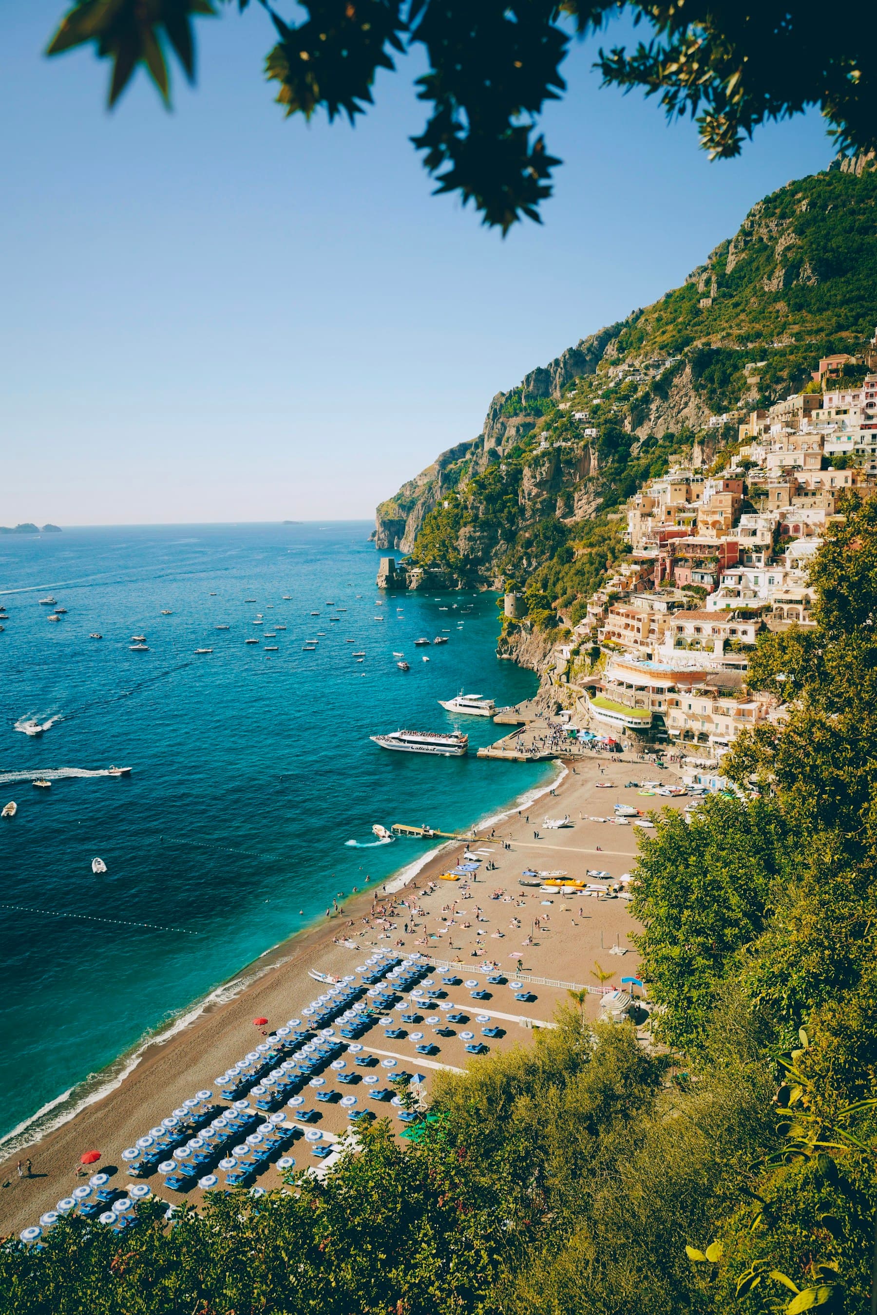 Positano beach and boats along the Amalfi Coast